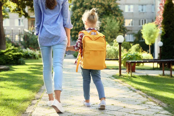 depositphotos_310579552-stock-photo-young-mother-taking-her-little