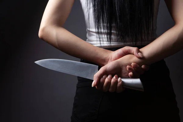 depositphotos_517254210-stock-photo-woman-holding-knife
